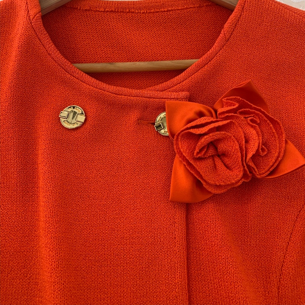 St. John burnt orange skirt and jacket set.